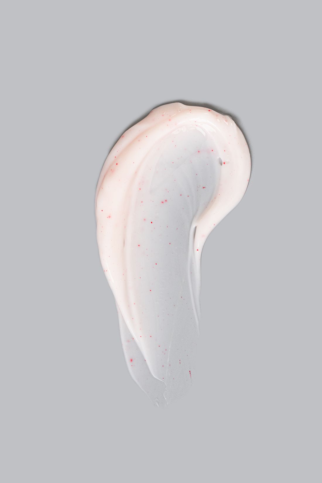 A sculptural cream swatch with pink flecks