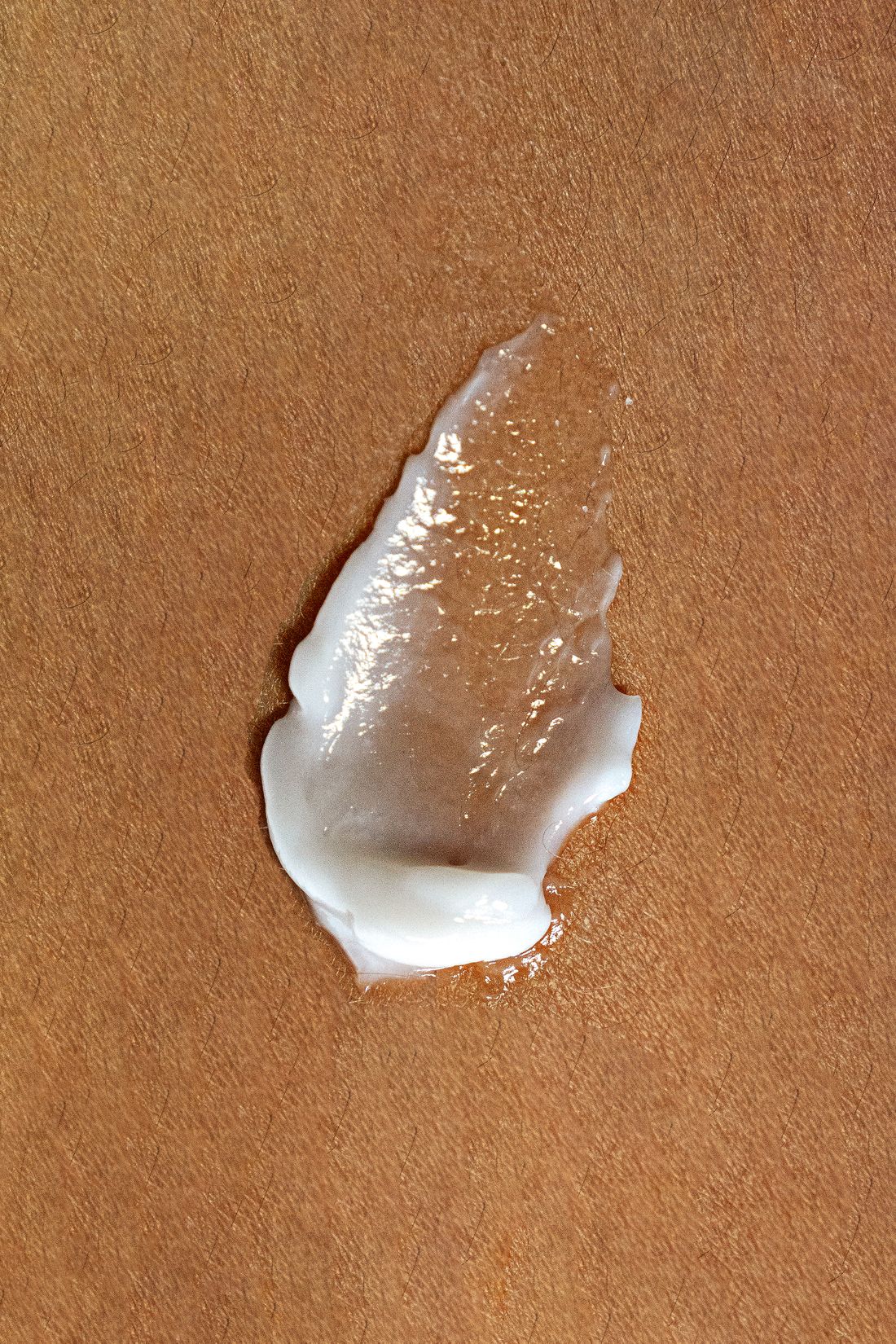 Close-up of a cream swatch on natural skin